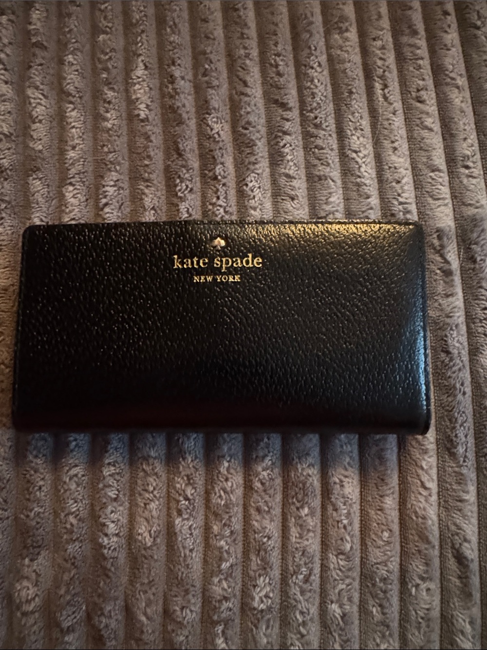kate spade black pebbled leather continental wallet with gold logo